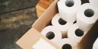istockphoto-1179797972-612×612 Toilet paper in carton craft box in plastic free store. Sustainable personal hygiene items, toiletries products in zero waste shop. Minimalist lifestyle